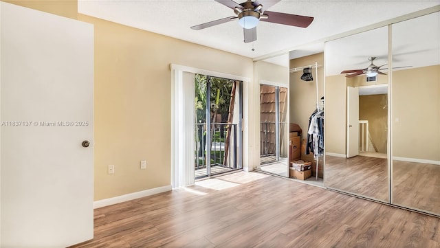 135 Heritage Way, West Palm Beach, FL 33407 - empty room with ceiling fan and wood finished floors