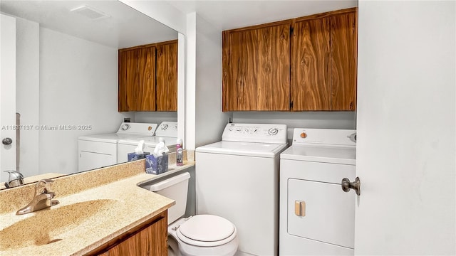 135 Heritage Way, West Palm Beach, FL 33407 - bathroom featuring washer and dryer and vanity