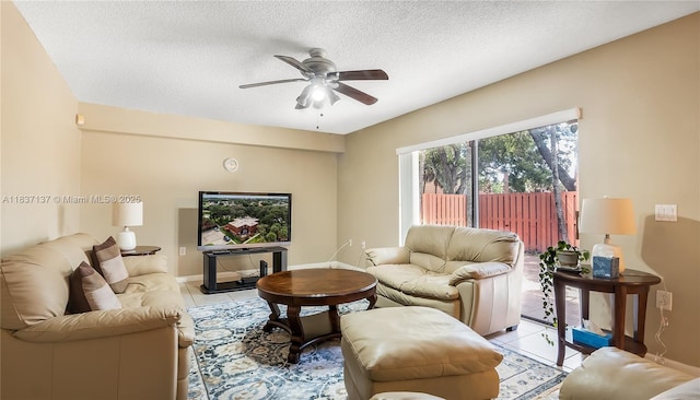 135 Heritage Way, West Palm Beach, FL 33407 - living area with a ceiling fan, a textured ceiling, and light tile patterned floors