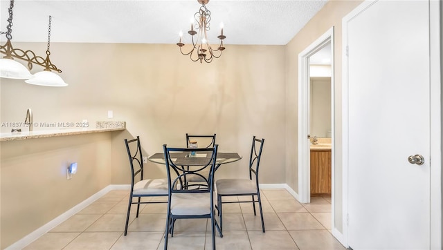 135 Heritage Way, West Palm Beach, FL 33407 - dining room featuring light tile patterned floors and a textured ceiling