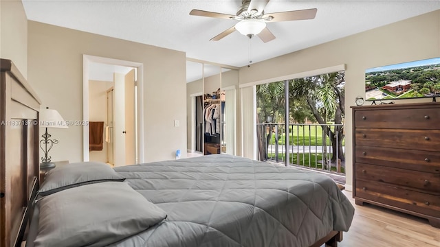 135 Heritage Way, West Palm Beach, FL 33407 - bedroom with access to outside, multiple windows, wood finished floors, and ceiling fan