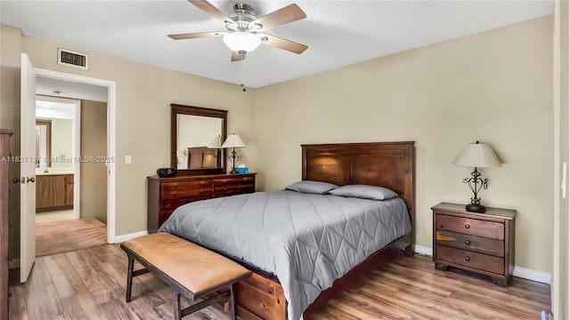 135 Heritage Way, West Palm Beach, FL 33407 - bedroom featuring wood finished floors, ceiling fan, and a textured ceiling