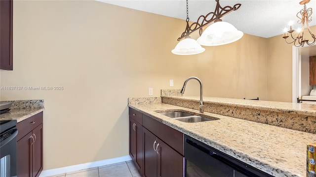 135 Heritage Way, West Palm Beach, FL 33407 - kitchen featuring light stone counters, light tile patterned floors, decorative light fixtures, and dishwashing machine