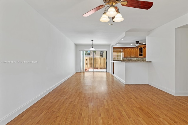8713 SW 137th Ave Unit 8713, Miami, FL 33183 - unfurnished living room featuring ceiling fan and light wood-style flooring