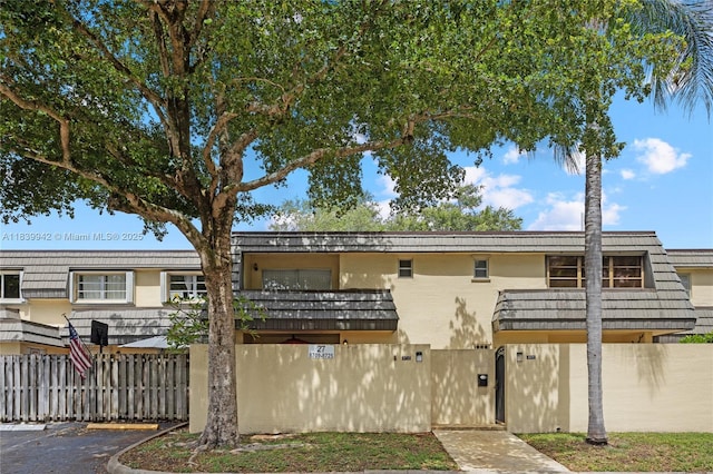 8713 SW 137th Ave Unit 8713, Miami, FL 33183 - view of front of home featuring stucco siding and uncovered parking
