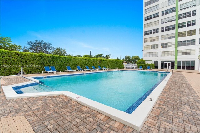 2100 W Sans Souci Blvd Unit E1, North Miami, FL 33181 - community pool with a patio area