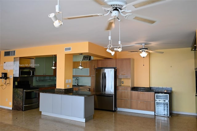 2100 W Sans Souci Blvd Unit E1, North Miami, FL 33181 - kitchen with ceiling fan, appliances with stainless steel finishes, decorative light fixtures, dark stone countertops, and brown cabinets