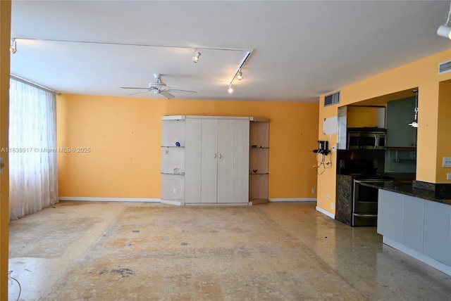 2100 W Sans Souci Blvd Unit E1, North Miami, FL 33181 - unfurnished living room featuring a ceiling fan and baseboards