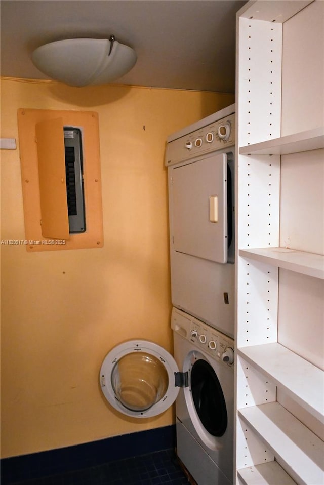 2100 W Sans Souci Blvd Unit E1, North Miami, FL 33181 - laundry area with stacked washer / dryer and electric panel
