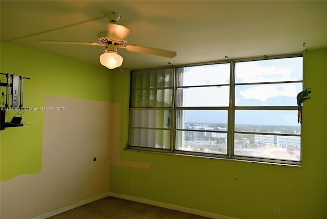 2100 W Sans Souci Blvd Unit E1, North Miami, FL 33181 - empty room with baseboards and ceiling fan