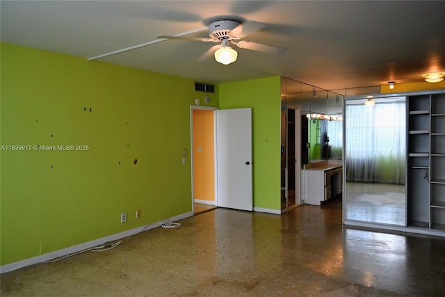 2100 W Sans Souci Blvd Unit E1, North Miami, FL 33181 - unfurnished room with a ceiling fan and baseboards