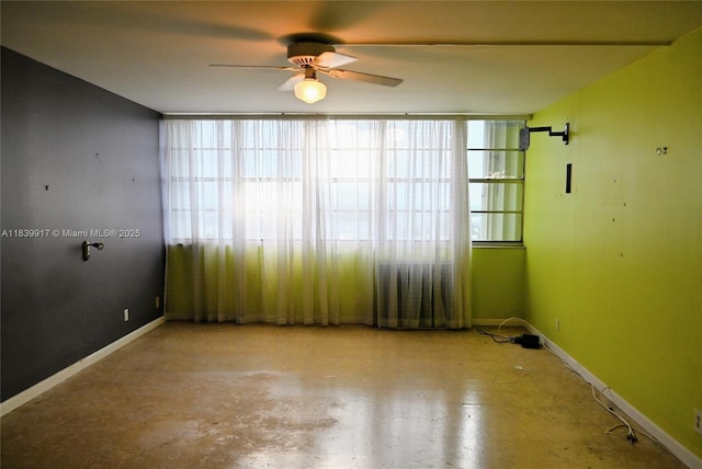 2100 W Sans Souci Blvd Unit E1, North Miami, FL 33181 - spare room featuring ceiling fan and baseboards