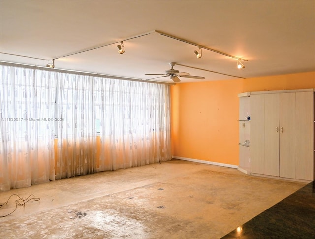 2100 W Sans Souci Blvd Unit E1, North Miami, FL 33181 - unfurnished room featuring rail lighting and ceiling fan