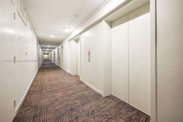 2100 W Sans Souci Blvd Unit E1, North Miami, FL 33181 - hallway with elevator, carpet floors, and recessed lighting
