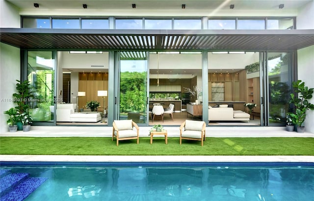 967 NE 117th St, Biscayne Park, FL 33161 - rear view of property featuring an outdoor living space, an outdoor pool, and a lawn