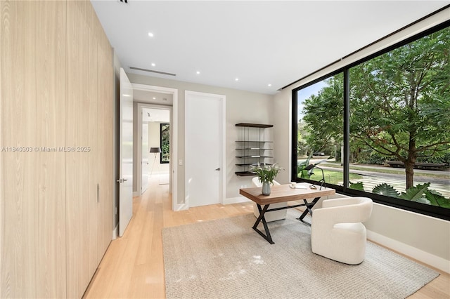 967 NE 117th St, Biscayne Park, FL 33161 - sitting room featuring light wood-type flooring, recessed lighting, and floor to ceiling windows