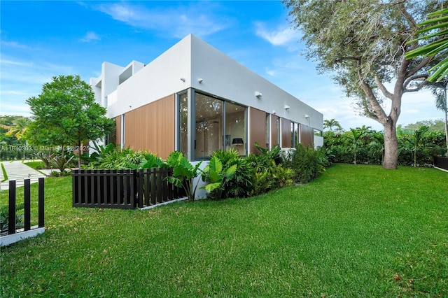 967 NE 117th St, Biscayne Park, FL 33161 - view of property exterior featuring a lawn