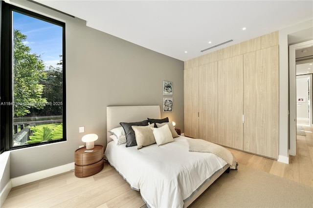 967 NE 117th St, Biscayne Park, FL 33161 - bedroom with light wood finished floors and recessed lighting