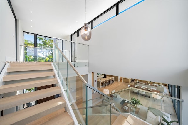 967 NE 117th St, Biscayne Park, FL 33161 - stairs featuring wood finished floors and expansive windows