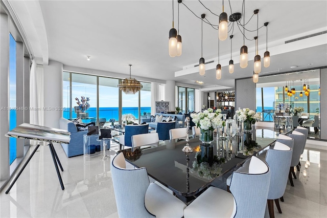 17901 Collins Ave Unit Ts4205, Sunny Isles Beach, FL 33160 - dining area with a chandelier, healthy amount of natural light, and a water view