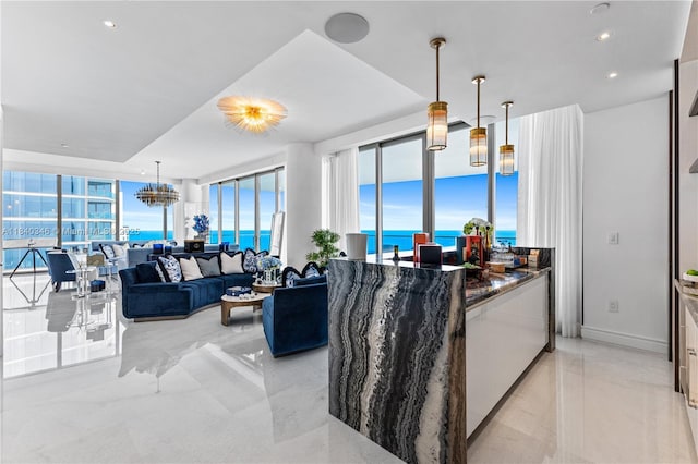 17901 Collins Ave Unit Ts4205, Sunny Isles Beach, FL 33160 - kitchen featuring decorative light fixtures, dark stone countertops, plenty of natural light, floor to ceiling windows, and recessed lighting