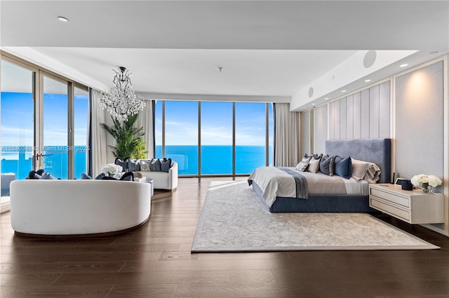 17901 Collins Ave Unit Ts4205, Sunny Isles Beach, FL 33160 - bedroom featuring expansive windows, access to exterior, hardwood / wood-style flooring, and a chandelier