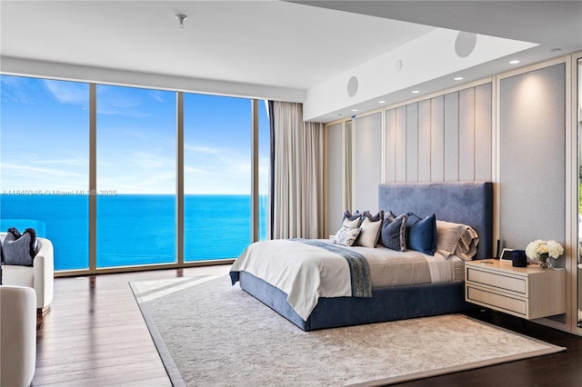 17901 Collins Ave Unit Ts4205, Sunny Isles Beach, FL 33160 - bedroom featuring wood finished floors, a water view, expansive windows, and recessed lighting