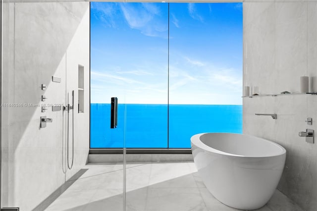 17901 Collins Ave Unit Ts4205, Sunny Isles Beach, FL 33160 - bathroom featuring a soaking tub, marble finish floors, and a shower