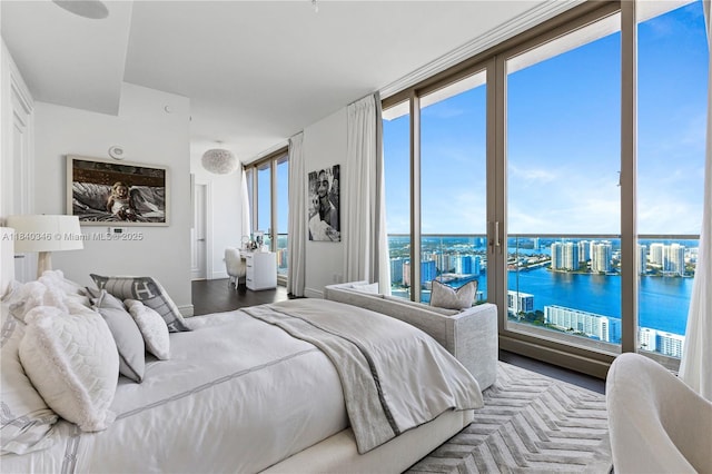 17901 Collins Ave Unit Ts4205, Sunny Isles Beach, FL 33160 - bedroom with a water view, access to exterior, and wood finished floors