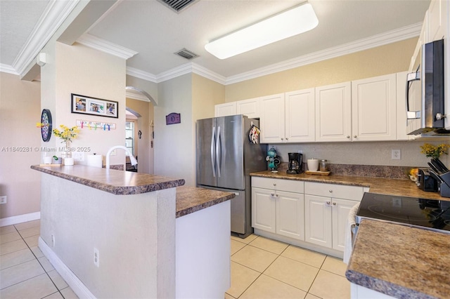 9333 SW 227th St Unit 8-6, Cutler Bay, FL 33190 - kitchen featuring light tile patterned floors, arched walkways, crown molding, appliances with stainless steel finishes, and white cabinetry