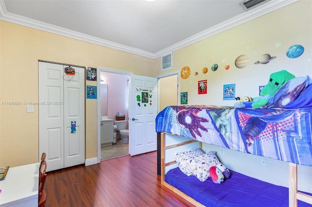 9333 SW 227th St Unit 8-6, Cutler Bay, FL 33190 - bedroom featuring ornamental molding, wood finished floors, and ensuite bath