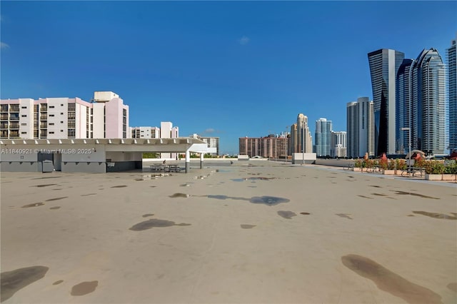 16919 N Bay Rd Unit 204, Sunny Isles Beach, FL 33160 - view of vehicle parking featuring a skyline view