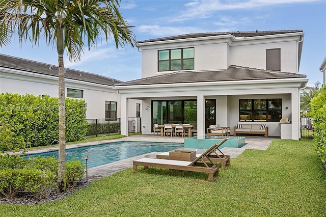 13467 Artisan Cir, Palm Beach Gardens, FL 33418 - rear view of property with a tiled roof, stucco siding, an outdoor pool, an outdoor living space, and a patio