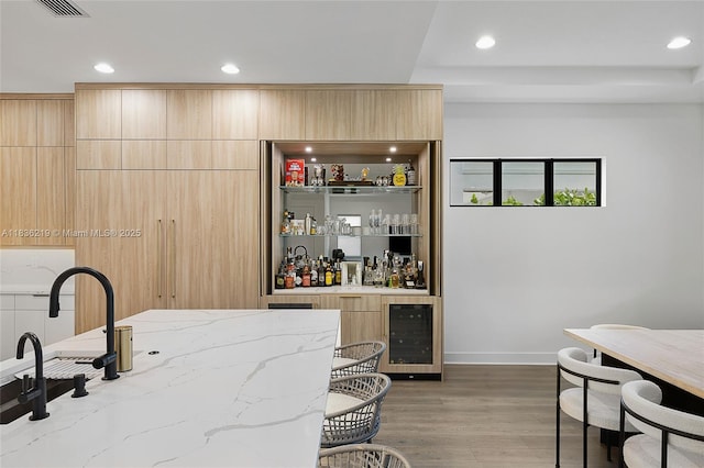 13467 Artisan Cir, Palm Beach Gardens, FL 33418 - indoor wet bar featuring beverage cooler, recessed lighting, and wood finished floors