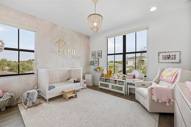 13467 Artisan Cir, Palm Beach Gardens, FL 33418 - bedroom with wood finished floors, a chandelier, and recessed lighting