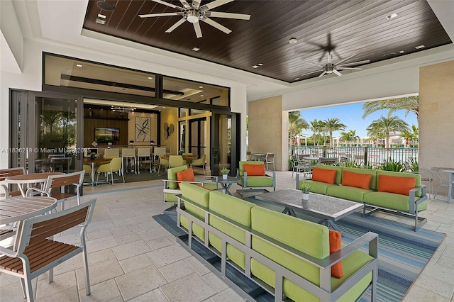 13467 Artisan Cir, Palm Beach Gardens, FL 33418 - view of patio featuring a ceiling fan and an outdoor living space