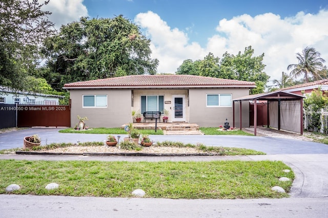 1004 NE 151st Ter, North Miami Beach, FL 33162 - single story home featuring curved driveway and a tiled roof