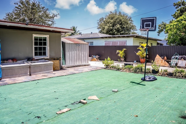 1004 NE 151st Ter, North Miami Beach, FL 33162 - view of yard featuring a putting area and a patio