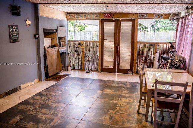 1004 NE 151st Ter, North Miami Beach, FL 33162 - doorway to outside featuring tile patterned floors