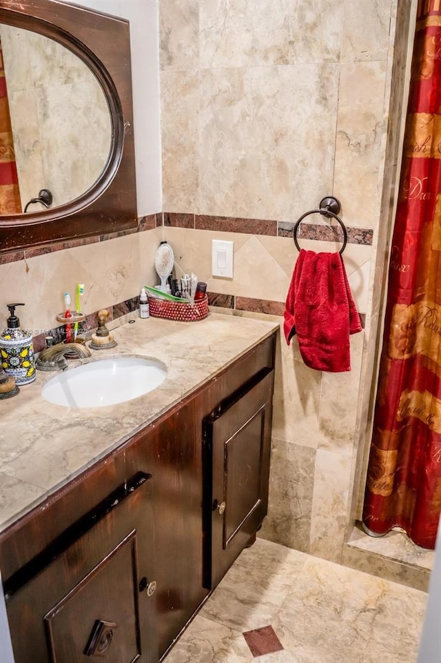 1004 NE 151st Ter, North Miami Beach, FL 33162 - bathroom featuring tile walls, vanity, and a shower with curtain