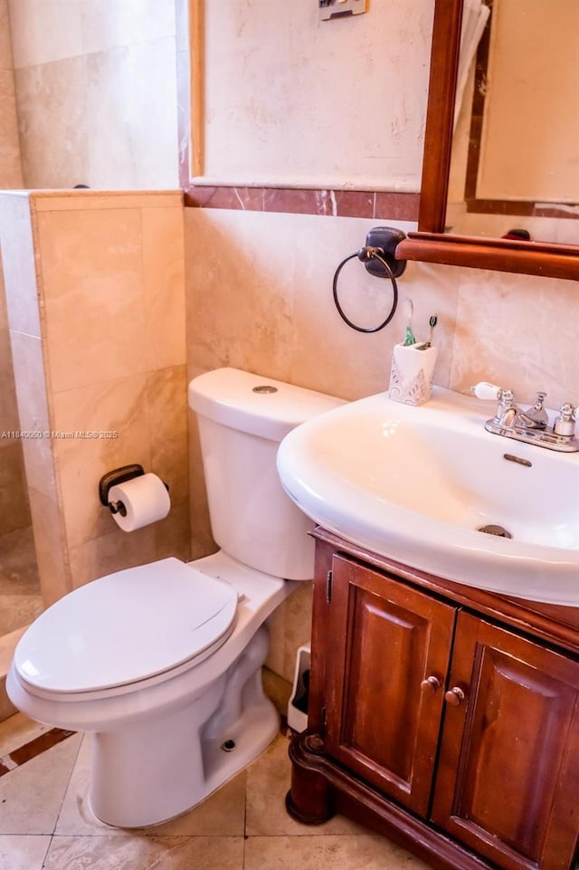 1004 NE 151st Ter, North Miami Beach, FL 33162 - bathroom featuring vanity, tile walls, and tile patterned floors