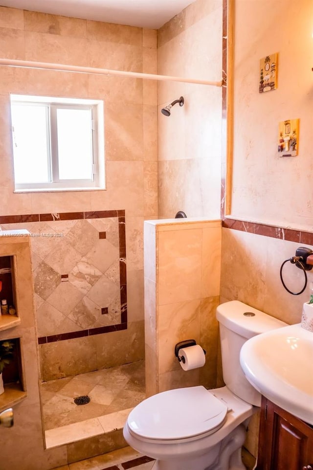 1004 NE 151st Ter, North Miami Beach, FL 33162 - full bath featuring tile walls, a tile shower, and vanity