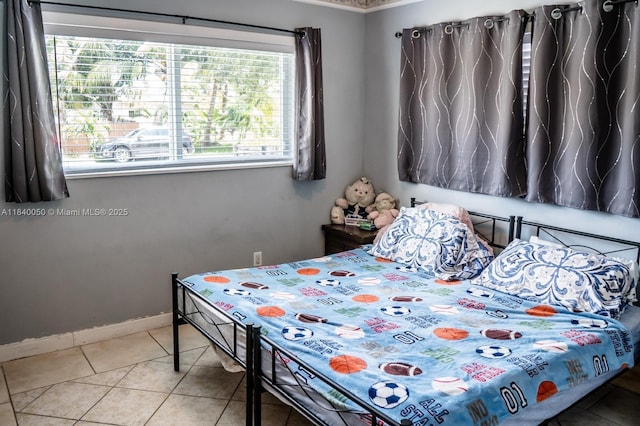 1004 NE 151st Ter, North Miami Beach, FL 33162 - bedroom featuring tile patterned floors and baseboards