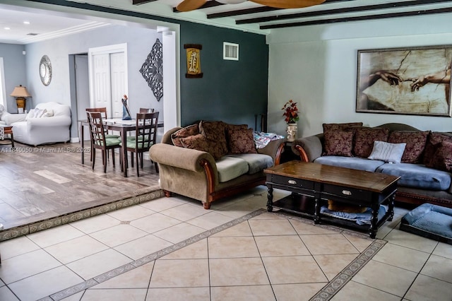 1004 NE 151st Ter, North Miami Beach, FL 33162 - living room with light tile patterned flooring, ceiling fan, beam ceiling, recessed lighting, and inlaid floor details