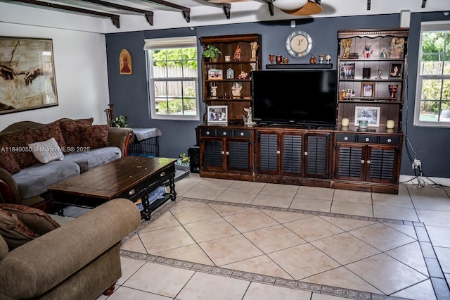 1004 NE 151st Ter, North Miami Beach, FL 33162 - living room with tile patterned floors, plenty of natural light, and beamed ceiling