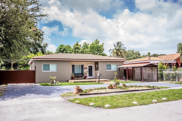 1004 NE 151st Ter, North Miami Beach, FL 33162 - single story home with curved driveway and a porch