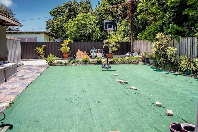 1004 NE 151st Ter, North Miami Beach, FL 33162 - fenced backyard featuring an area to practice putting