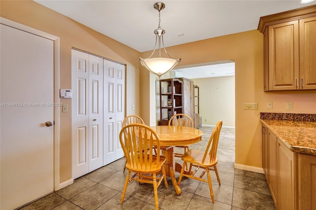 53 Northwoods Ln, Boynton Beach, FL 33436 - dining area with baseboards and tile patterned floors