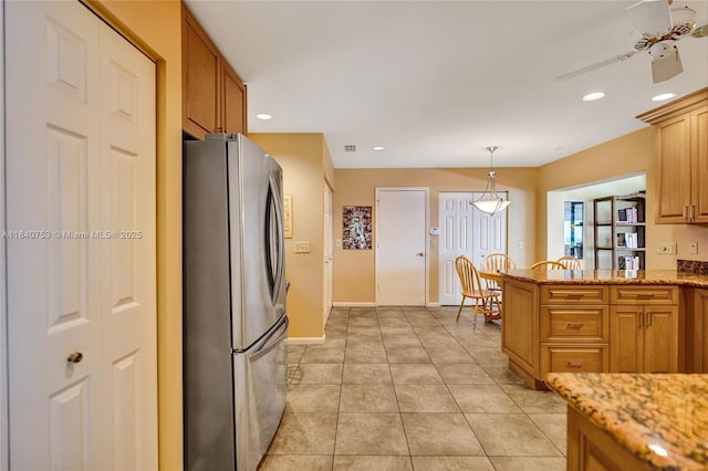 53 Northwoods Ln, Boynton Beach, FL 33436 - kitchen with freestanding refrigerator, a ceiling fan, recessed lighting, light stone counters, and hanging light fixtures