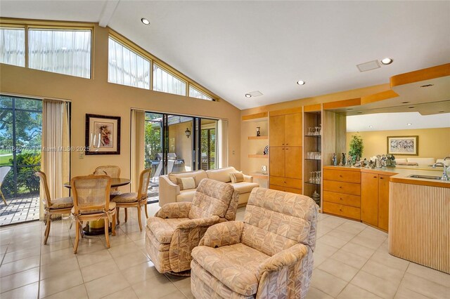 53 Northwoods Ln, Boynton Beach, FL 33436 - living room featuring light tile patterned floors, plenty of natural light, high vaulted ceiling, beamed ceiling, and recessed lighting